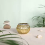 Tea Light Holder In Golden Finish With Glass Beads Rim